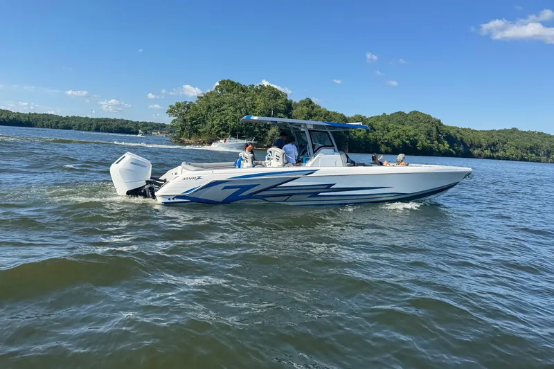 Slide: The Image of 2024 Donzi 39 VRZ boat with Mercury engine in a covered dock. - 4