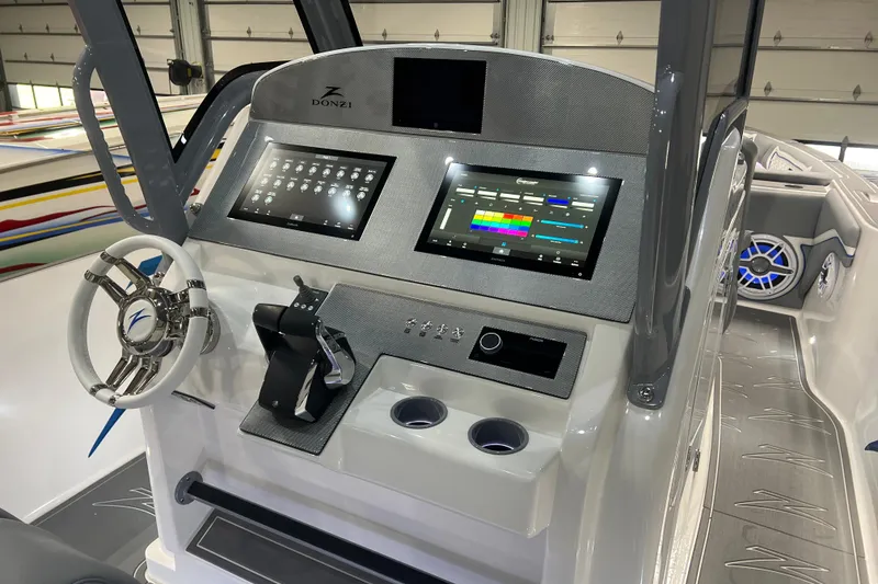Slide: The Image of 2024 Donzi 39 VRZ touchscreen control panel with various boat system options. - 42