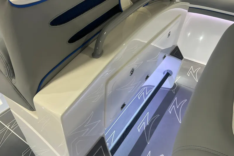 Slide: The Image of 2024 Donzi 39 VRZ boat interior with sleek, modern seating and control panel. - 48