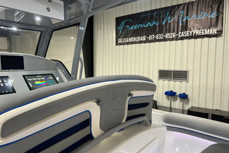 Slide: The Image of 2024 Donzi 39 VRZ boat interior with detailed upholstery and emblem design. - 50