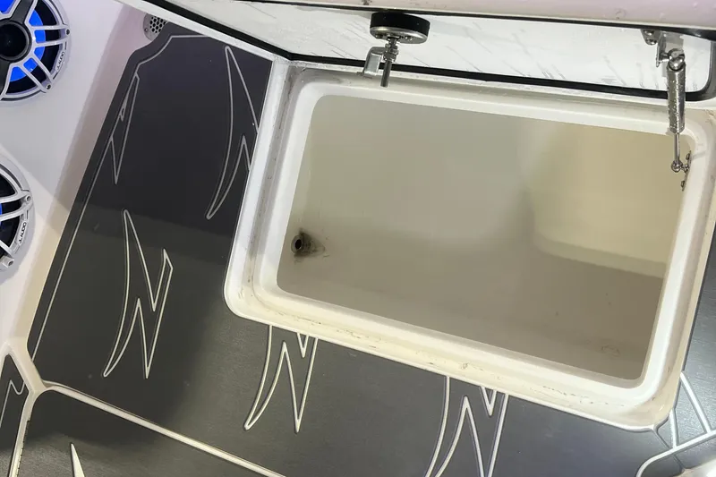 Slide: The Image of 2024 Donzi 39 VRZ boat interior with stylish gray and white seating. - 52