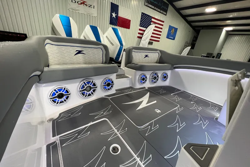 Slide: The Image of 2024 Donzi 39 VRZ boat interior with blue LED speakers and stylish seating. - 54