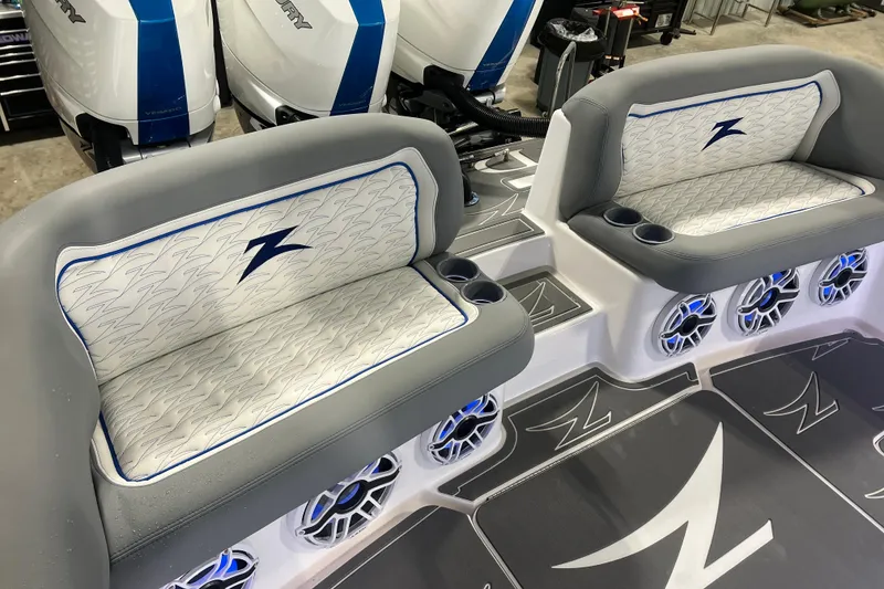Slide: The Image of 2024 Donzi 39 VRZ boat interior with stylish seating and modern audio system. - 55