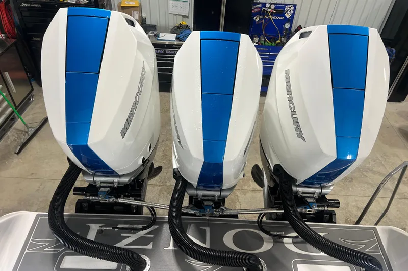 Slide: The Image of 2024 Donzi 39 VRZ boat interior with cushioned seating and cup holders. - 56