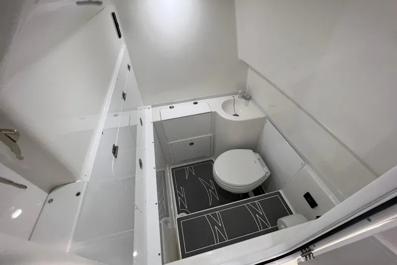 Slide: The Image of 2024 Donzi 39 VRZ boat bathroom with compact sink and toilet. - 65