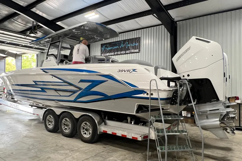 Slide: The Image of 2024 Donzi 39 VRZ boat interior bathroom with toilet and sink. - 66