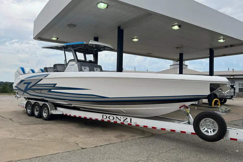 Slide: The Image of 2024 Donzi 39 VRZ boat on trailer at gas station, ready for transport. - 72