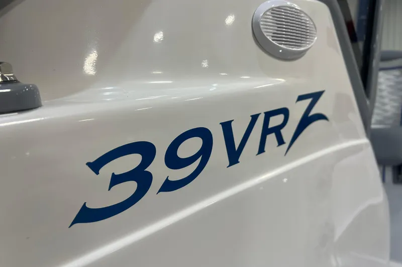 Slide: The Image of 2024 Donzi 39 VRZ boat interior with modern seating, LED lighting, and premium audio system. - 8