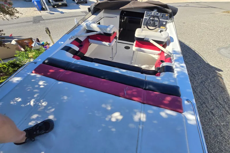 Slide: The Image of Engine compartment of a 1990 Baja 250 ES with visible wiring and components. - 2