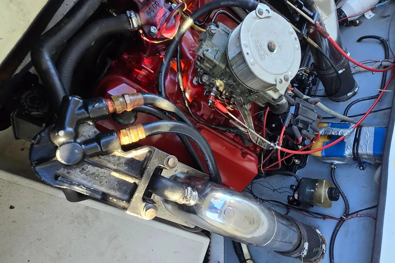 Slide: The Image of 1990 Baja 250 ES engine compartment with visible wiring and components. - 9