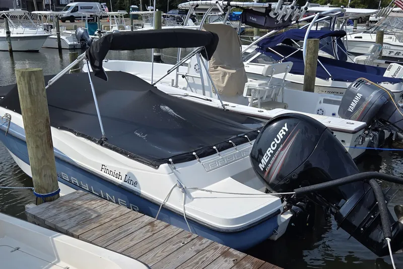 Slide: The Image of 2012 Bayliner 190 Bowrider with Mercury engine docked at marina. - 10