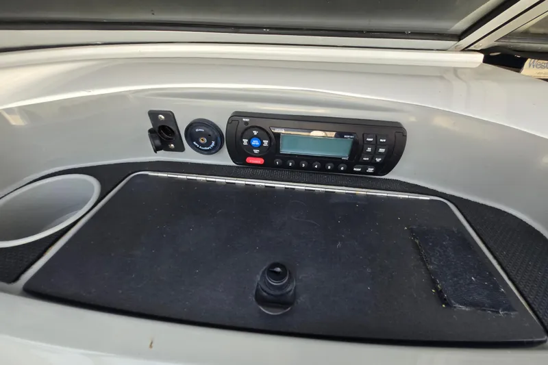 Slide: The Image of 2012 Bayliner 190 Bowrider dashboard with stereo system and control panel. - 11