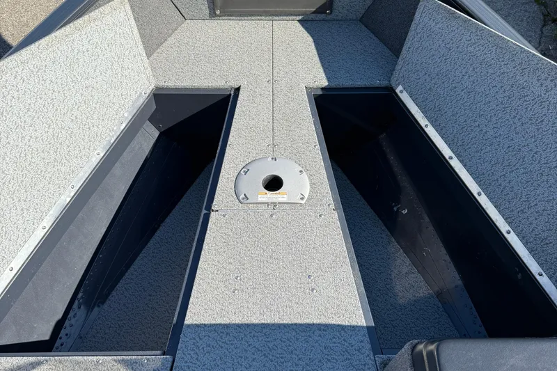 Slide: The Image of 2021 Lund 1675 Adventure Sport boat interior with storage compartments. - 10