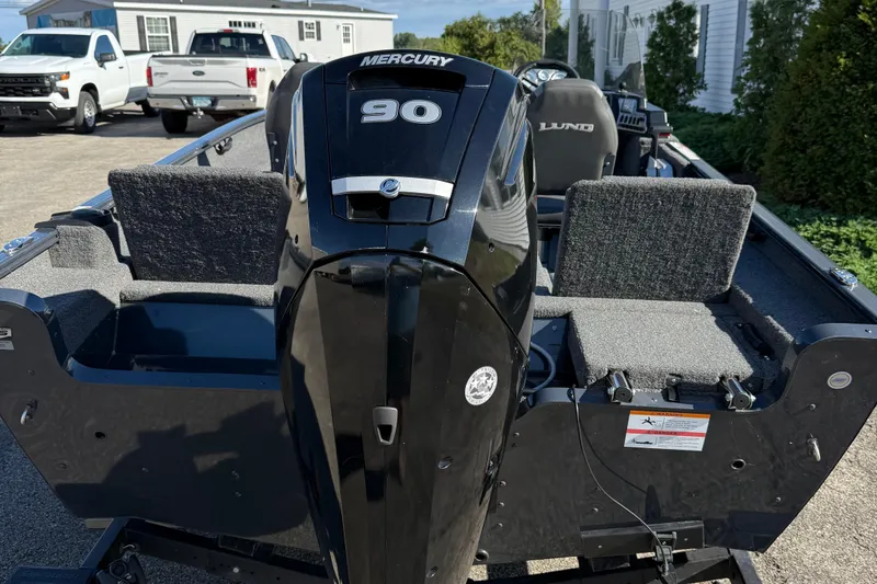 Slide: The Image of 2021 Lund 1675 Adventure Sport boat with Mercury 90 engine, parked outdoors. - 6