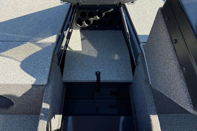 Slide: The Image of 2021 Lund 1675 Adventure Sport boat interior with storage compartment open. - 8