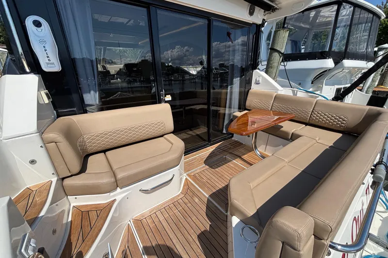 Slide: The Image of Luxurious 2018 Sea Ray Sundancer 460 yacht with elegant outdoor seating and wooden deck. - 3