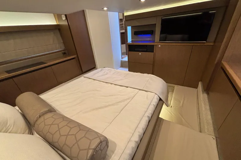 Slide: The Image of Luxurious interior of 2018 Sea Ray Sundancer 460 yacht with modern bedroom amenities. - 38
