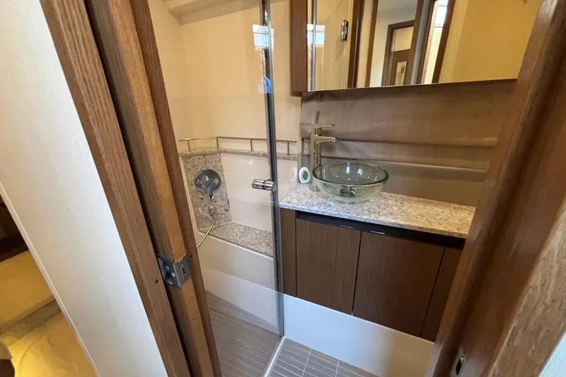 Slide: The Image of Luxurious bathroom in 2018 Sea Ray Sundancer 460 yacht with modern glass sink and shower. - 39