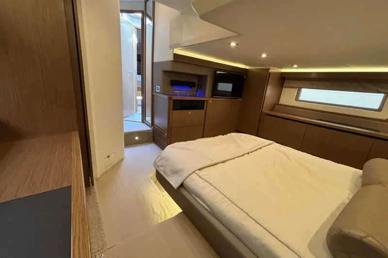 Slide: The Image of Luxurious interior of 2018 Sea Ray Sundancer 460 yacht, featuring a cozy bedroom. - 41