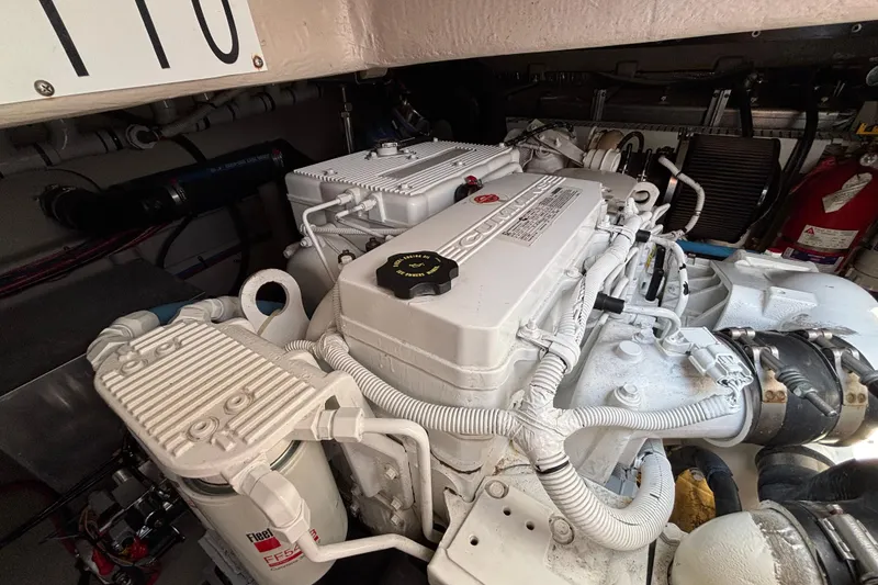 Slide: The Image of Engine compartment of 2018 Sea Ray Sundancer 460 yacht, featuring Cummins engine components. - 42