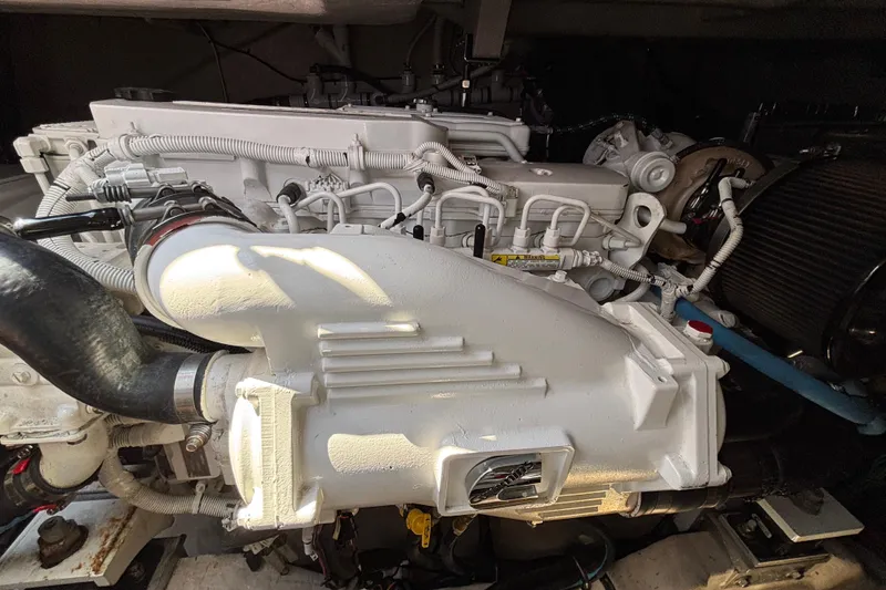 Slide: The Image of Engine compartment of a 2018 Sea Ray Sundancer 460 yacht, showcasing detailed machinery. - 47