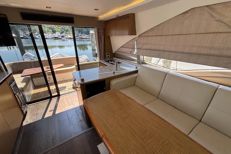 Slide: The Image of Luxurious interior of 2018 Sea Ray Sundancer 460 yacht with elegant seating and waterfront view. - 9