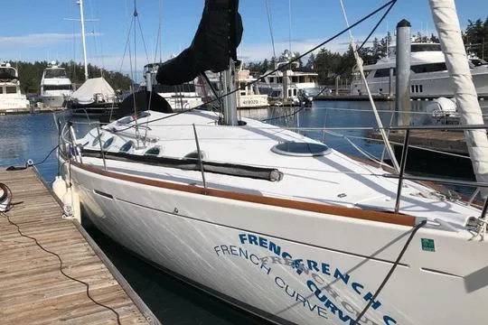 The Image of 1994 Beneteau First 35s-7 sailboat docked at a marina, surrounded by other boats. - 0