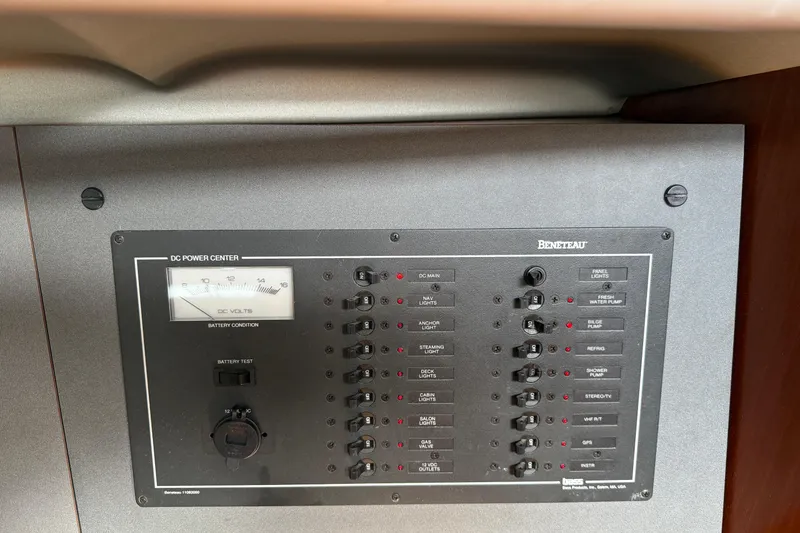 Slide: The Image of Control panel of a 1994 Beneteau First 35s-7 sailboat, featuring DC power center. - 12