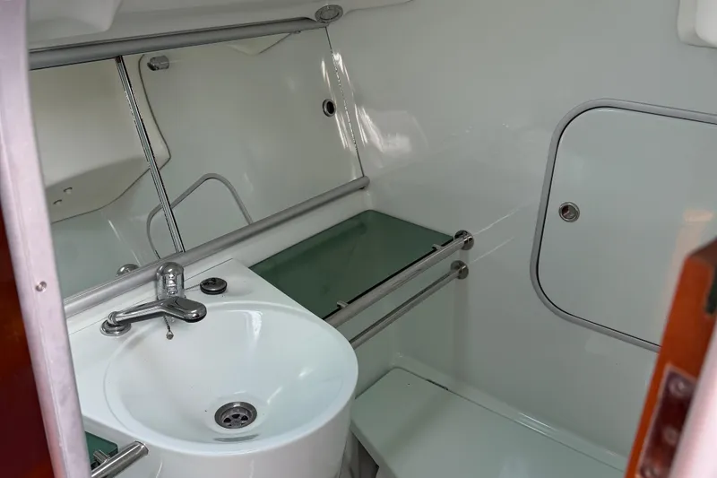 Slide: The Image of Bathroom interior of 1994 Beneteau First 35s-7 yacht with sink and mirror. - 15