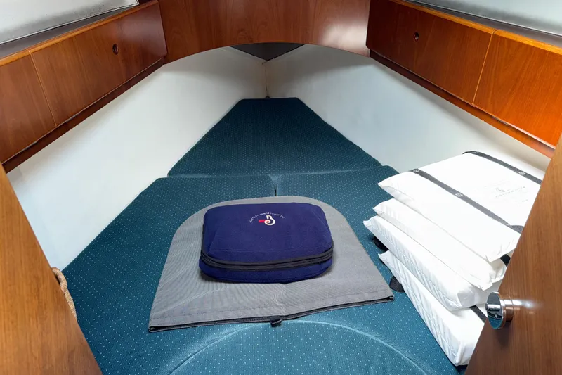 Slide: The Image of Cozy cabin interior of 1994 Beneteau First 35s-7 sailboat with cushions and storage. - 22