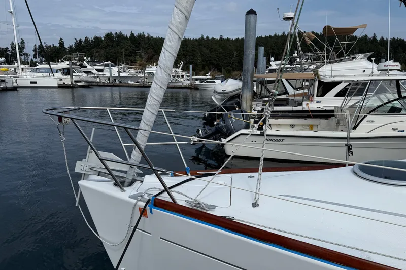 Slide: The Image of 1994 Beneteau First 35s-7 sailboat docked in a marina with other boats. - 6