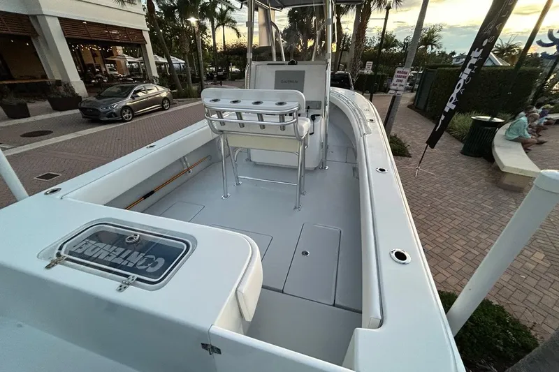 Slide: The Image of 2025 Contender 25 Tournament boat docked, showcasing spacious deck and seating area. - 20