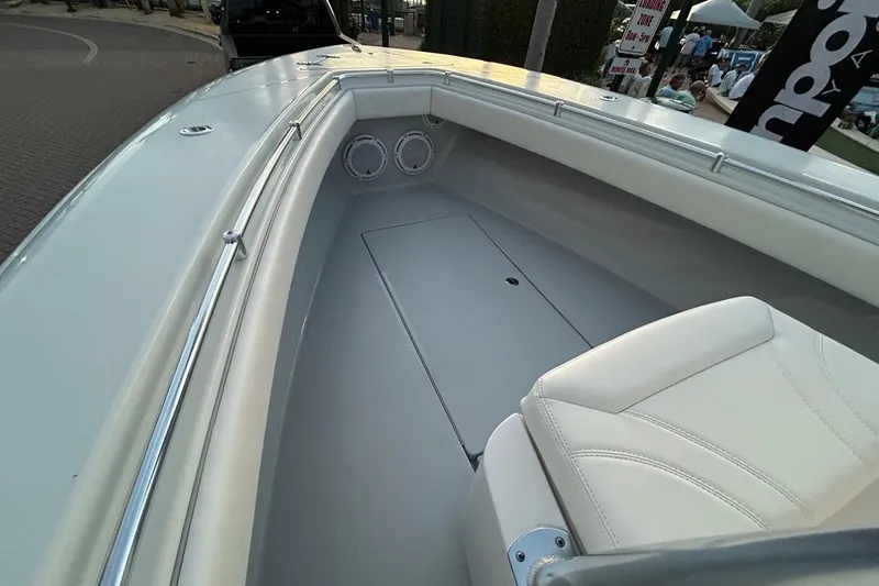 Slide: The Image of 2025 Contender 25 Tournament boat interior with white seating and speakers. - 22