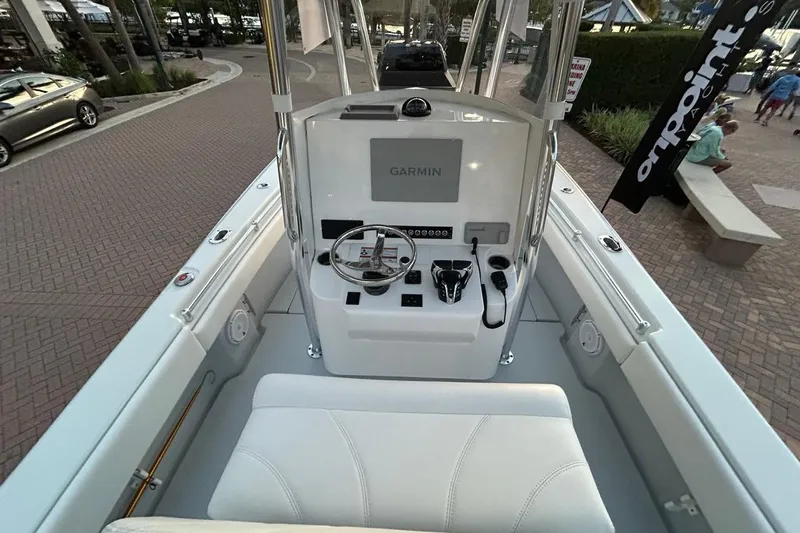 Slide: The Image of 2025 Contender 25 Tournament boat cockpit with Garmin navigation system and sleek design. - 24