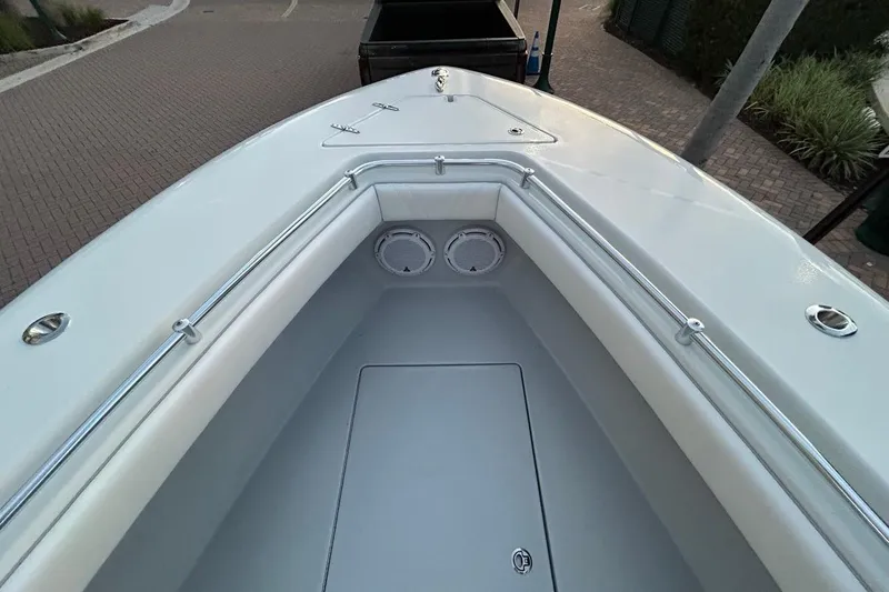 Slide: The Image of 2025 Contender 25 Tournament boat bow with sleek design and stainless steel railings. - 25