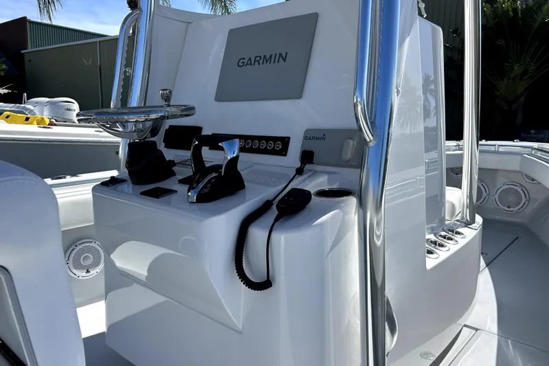 Slide: The Image of 2025 Contender 25 Tournament boat console with Garmin navigation system and controls. - 9