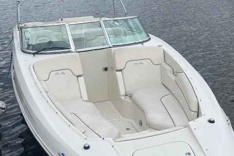 Slide: The Image of 2008 Sea Ray 290 Sundeck boat with spacious seating on calm water. - 4