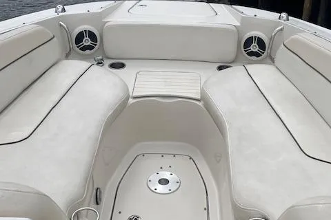 Slide: The Image of 2008 Sea Ray 290 Sundeck boat interior with white seating and cup holders. - 5