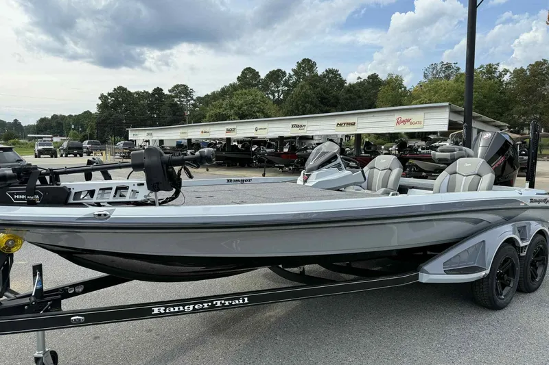 Slide: The Image of 2026 Ranger Z521 boat on trailer, parked outdoors with dealership in background. - 1