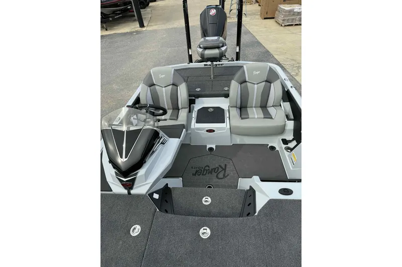 Slide: The Image of 2026 Ranger Z521 boat interior with gray seating and steering console. - 10
