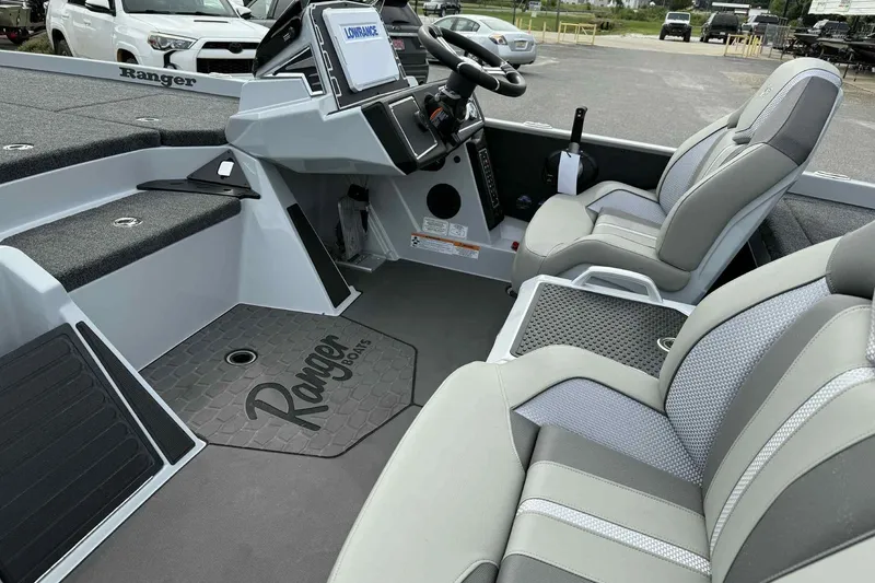 Slide: The Image of 2026 Ranger Z521 boat interior with modern seating and navigation system. - 11
