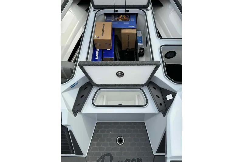 Slide: The Image of 2026 Ranger Z521 boat storage compartment with equipment and accessories. - 12