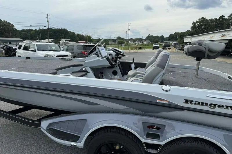 Slide: The Image of 2026 Ranger Z521 boat in a parking lot, showcasing sleek design and modern features. - 4