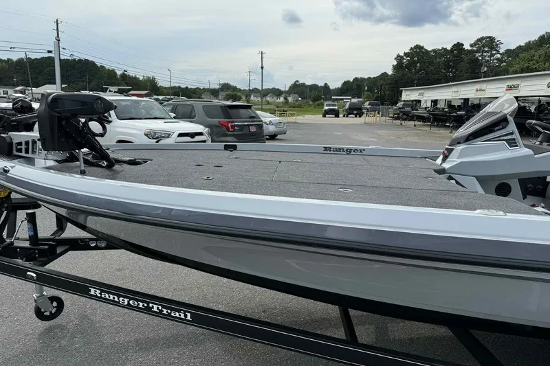 Slide: The Image of 2026 Ranger Z521 boat on trailer in parking lot, surrounded by vehicles. - 5