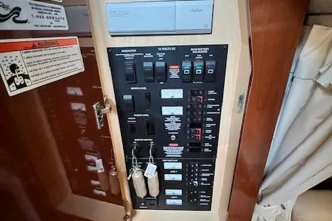 Slide: The Image of Electrical panel inside 2008 Sea Ray 340 Sundancer boat, featuring various switches and controls. - 20