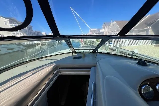 Slide: The Image of 2008 Sea Ray 340 Sundancer cockpit view, docked in a residential marina. - 22