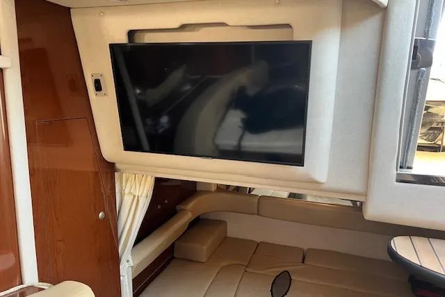 Slide: The Image of Interior of 2008 Sea Ray 340 Sundancer with TV and seating area. - 23
