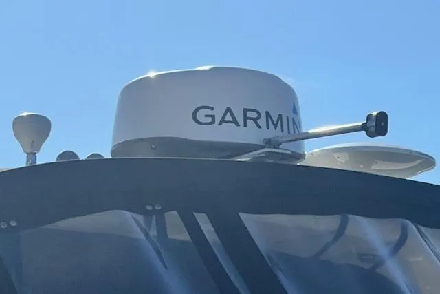 Slide: The Image of Garmin radar on 2008 Sea Ray 340 Sundancer against clear blue sky. - 27