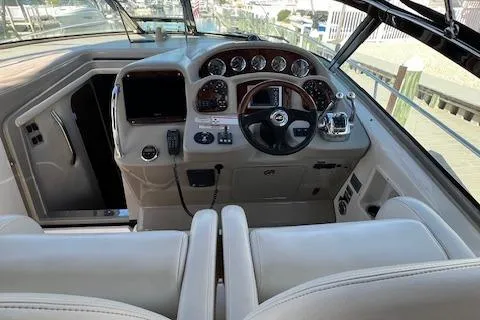 Slide: The Image of 2008 Sea Ray 340 Sundancer helm with modern controls and comfortable seating. - 3