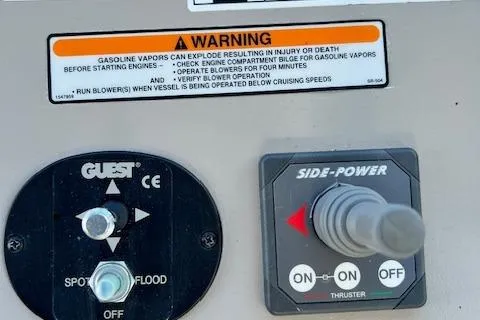 Slide: The Image of Control panel of a 2008 Sea Ray 340 Sundancer with warning label and thruster controls. - 6